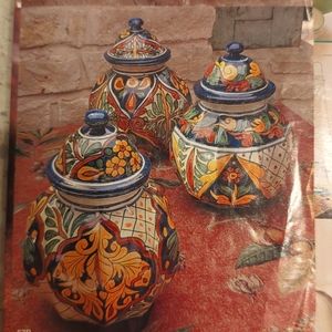 Hand painted terra-cotta canister set of three